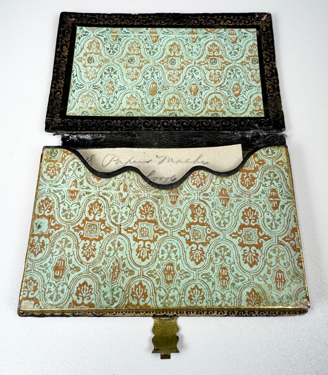 Open Victorian calling card case showing original-style patterned paper lining and shaped interior card pocket