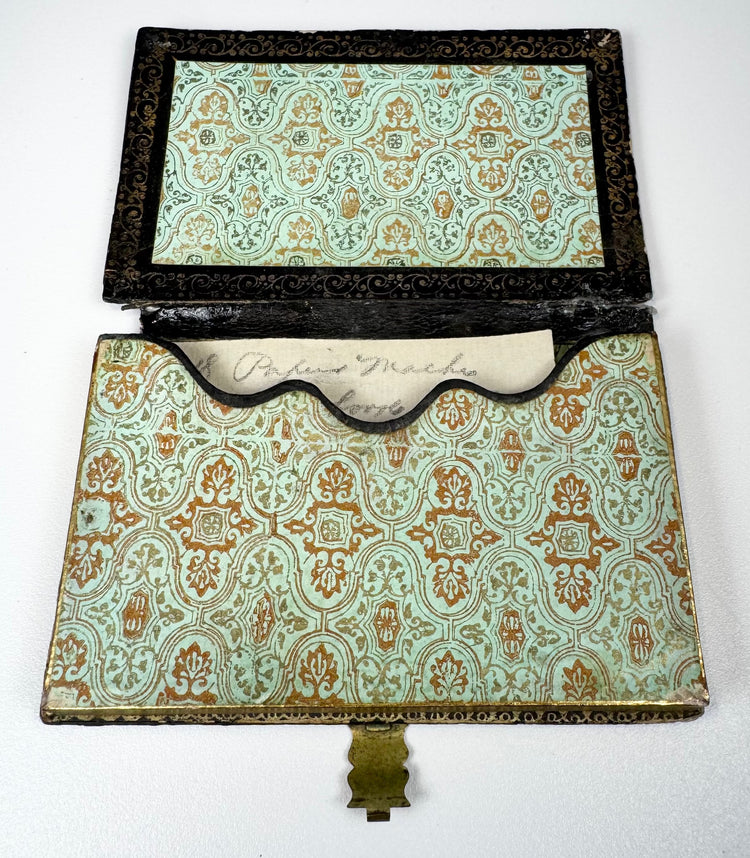 Open Victorian calling card case showing original-style patterned paper lining and shaped interior card pocket