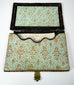 Open Victorian calling card case showing original-style patterned paper lining and shaped interior card pocket