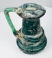 Late Roman glass vessel with thick raised trail decoration encircling the lower body