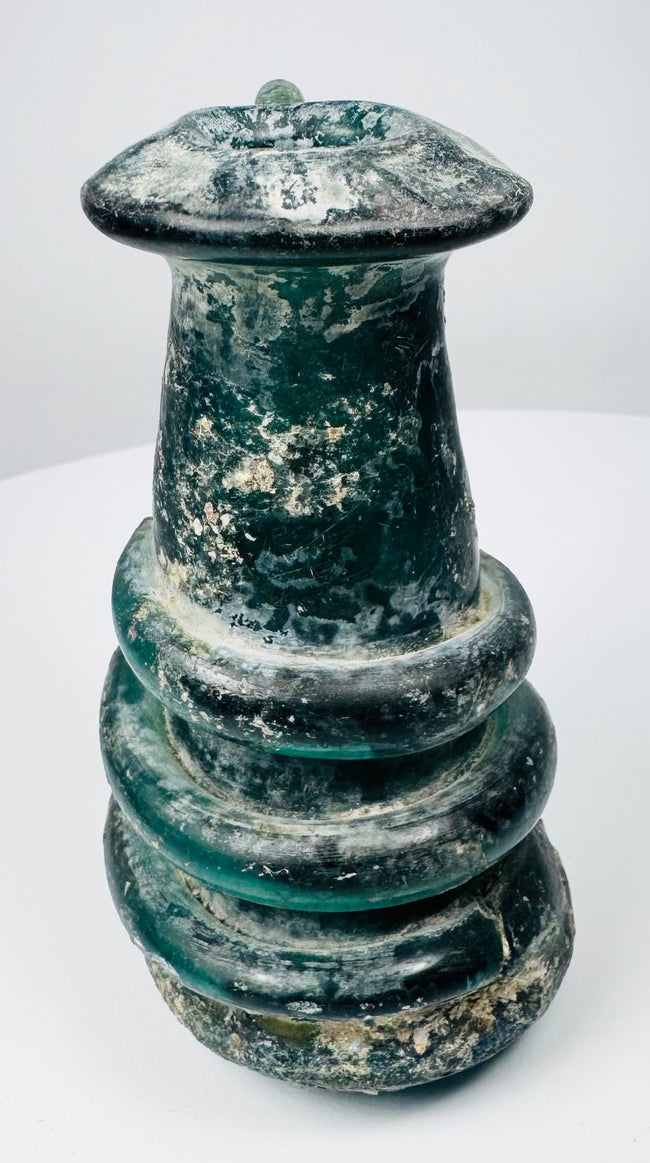 Ancient Roman blue-green glass vessel with applied trail ornament and pronounced archaeological patina