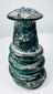 Ancient Roman blue-green glass vessel with applied trail ornament and pronounced archaeological patina