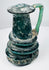 Ancient Roman blown-glass jug with rounded body, tall neck, and applied green glass handle