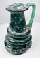 Ancient Roman blown-glass jug with rounded body, tall neck, and applied green glass handle