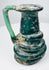 Ancient Roman green glass jug with flared rim, applied handle, and natural mineral encrustation