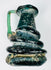 Ancient Roman glass jug with sculptural coiled glass trails and weathered archaeological surface