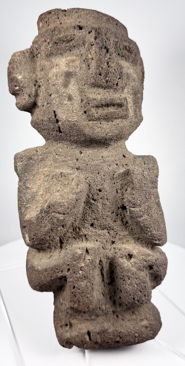 Dark volcanic stone figure from Guerrero tradition with strong geometric facial features