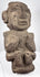 Dark volcanic stone figure from Guerrero tradition with strong geometric facial features