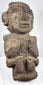 Dark volcanic stone figure from Guerrero tradition with strong geometric facial features