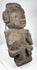Ancient Mexican stone sculpture with projecting nose, lateral ear forms, and compact body