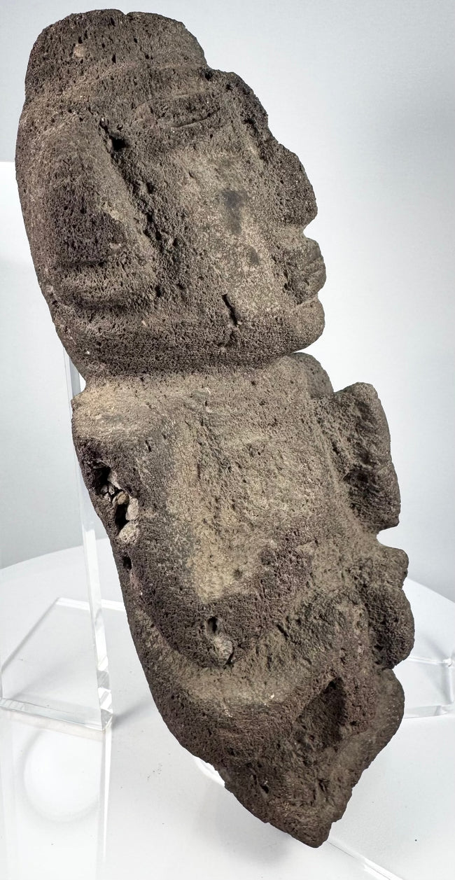 Pre-Columbian anthropomorphic effigy carved from naturally pitted volcanic stone