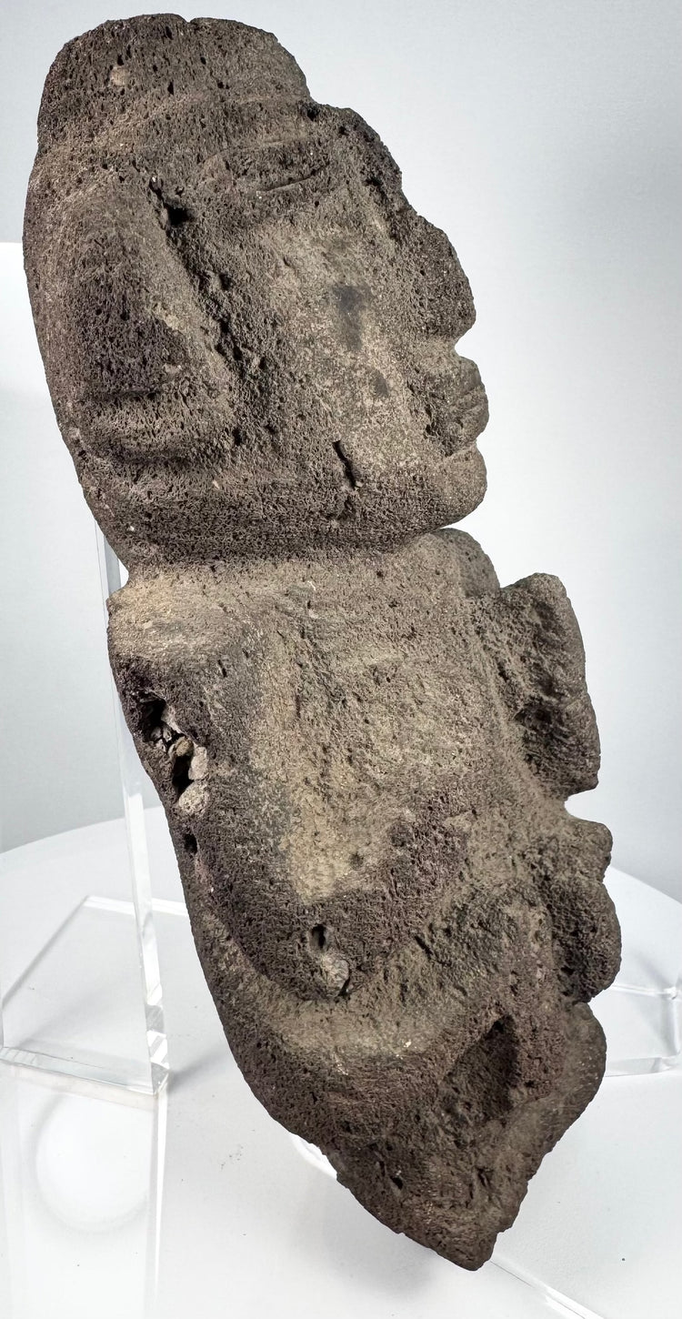 Pre-Columbian anthropomorphic effigy carved from naturally pitted volcanic stone