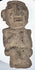Ancient Guerrero stone figure highlighting carved facial details and textured archaeological surface