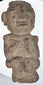 Ancient Guerrero stone figure highlighting carved facial details and textured archaeological surface