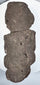 Back view of Pre-Columbian Guerrero stone figure showing flattened reverse and natural volcanic stone texture
