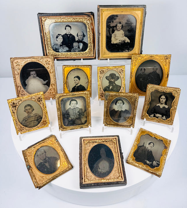 Civil War-era portrait photograph collection with gilt-brass mats, decorative cases, and historic family images