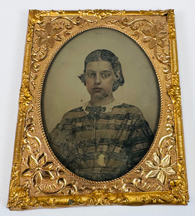 Cased family portrait showing adults and children in formal mid-19th-century clothing
