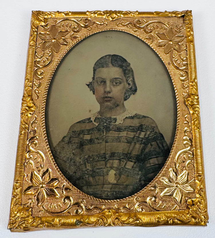 Cased family portrait showing adults and children in formal mid-19th-century clothing