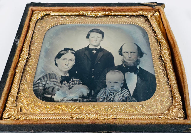 Victorian cased portrait of a woman with period hairstyle and dress within an oval gilt-brass mat
