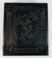 Ornately molded thermoplastic Union case with grapevine, floral, and scroll decoration