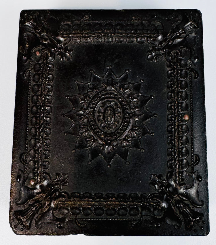 Victorian Union case displaying elaborate central medallion, scrollwork, and floral relief ornament