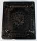 Victorian Union case displaying elaborate central medallion, scrollwork, and floral relief ornament