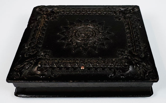 Closed antique photographic Union case showing dark molded exterior, decorative border, and period hardware
