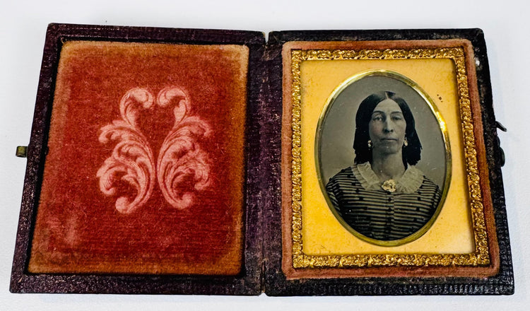 Smaller Victorian cased portrait of an older woman wearing a striped dress, white collar, earrings, and brooch
