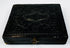 Closed mid-19th-century cased photograph with molded dark exterior, ornamental design, and metal clasp