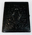 Antique photographic case with deeply embossed decorative exterior and age-related surface wear