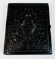 Antique photographic case with deeply embossed decorative exterior and age-related surface wear