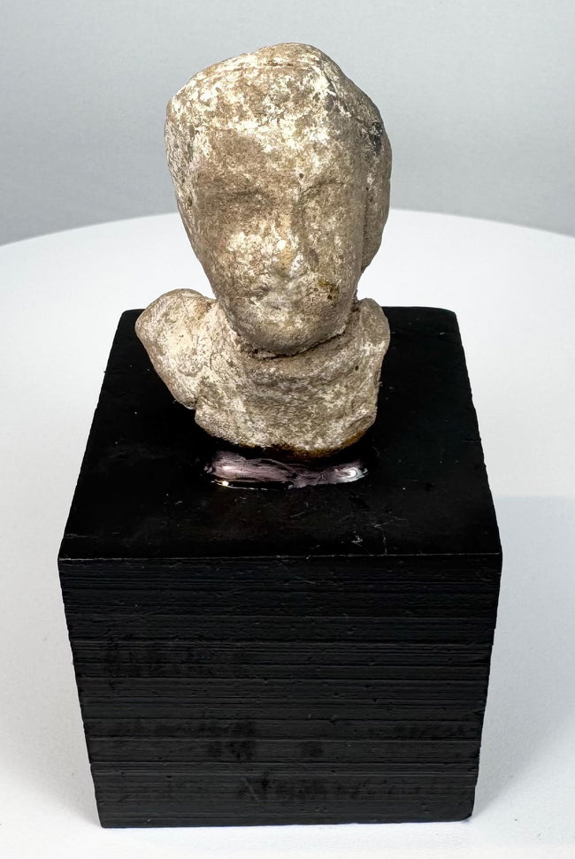 Late Archaic to Classical Greek terracotta protome mounted on a modern black display base
