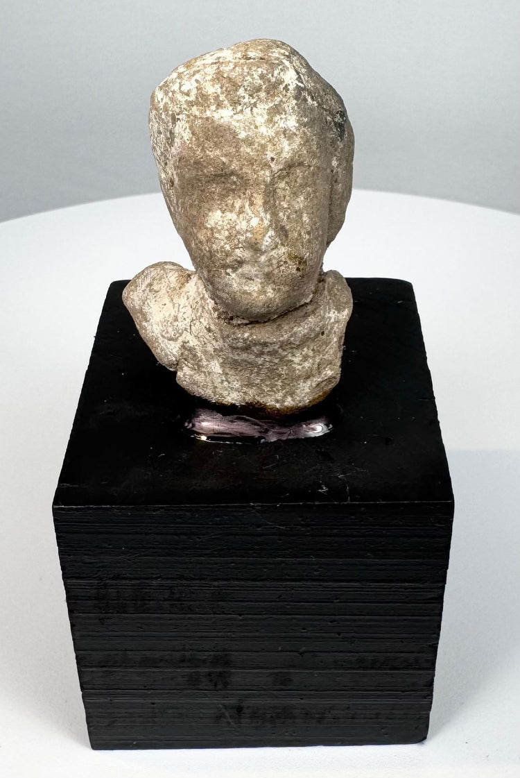 Late Archaic to Classical Greek terracotta protome mounted on a modern black display base