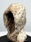 Ancient terracotta protome revealing deep concave interior and mold-made hollow construction
