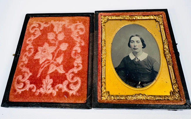 Larger Victorian cased portrait of a young woman in a dark dress with white collar and period hairstyle