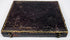 Antique photographic case with ornate embossed exterior, gilt border detailing, and metal closure hardware
