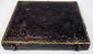 Antique photographic case with ornate embossed exterior, gilt border detailing, and metal closure hardware