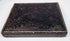 Victorian ambrotype case showing dark embossed floral exterior and age-related surface wear