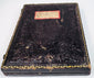 Embossed Victorian photographic case retaining handwritten family label and decorative gilt border