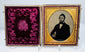 Victorian cased portrait of a gentleman in dark formal attire with white shirt, bow tie, and prominent sideburns