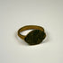 Ancient Roman bronze signet-style ring with vertical linear motifs and a solid cast circular band