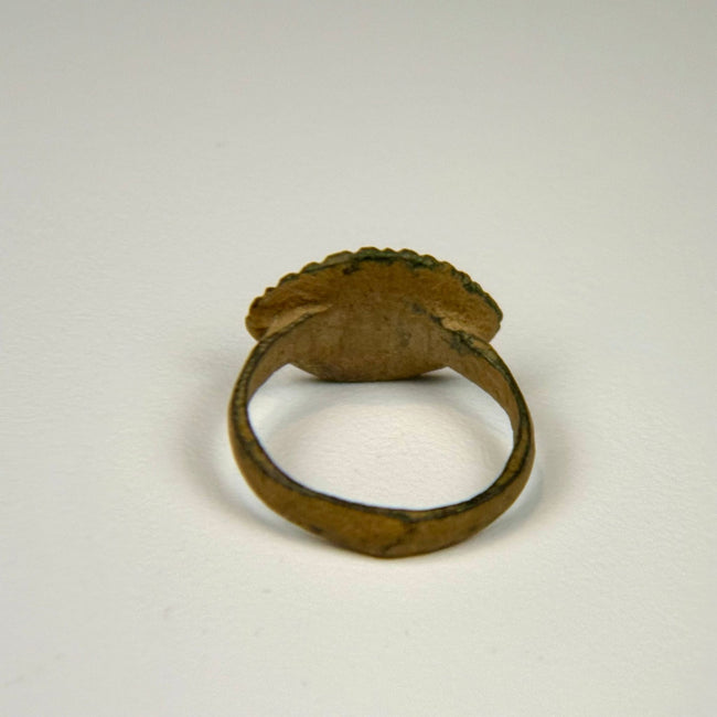 Ancient bronze ring from the Roman Empire featuring a simple engraved bezel and utilitarian cast construction