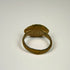 Ancient bronze ring from the Roman Empire featuring a simple engraved bezel and utilitarian cast construction
