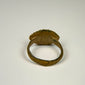 Ancient bronze ring from the Roman Empire featuring a simple engraved bezel and utilitarian cast construction