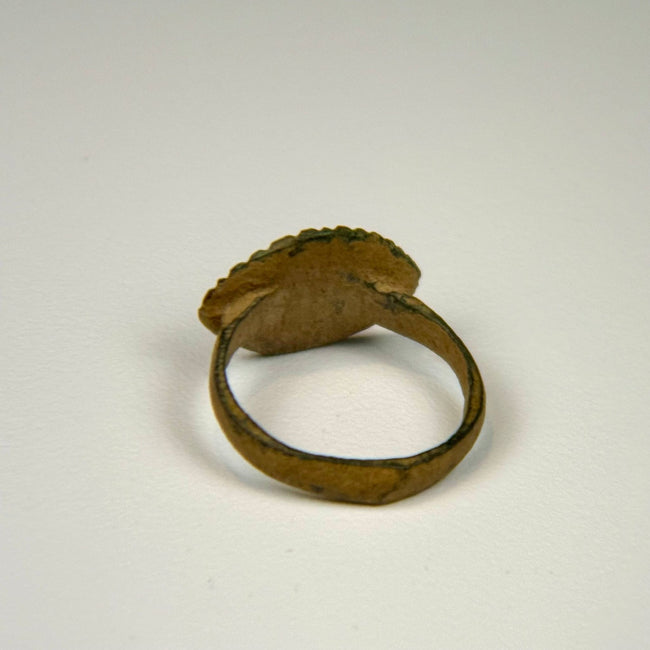 Roman Imperial bronze ring with intact hoop, oval decorative bezel, and naturally aged surface corrosion