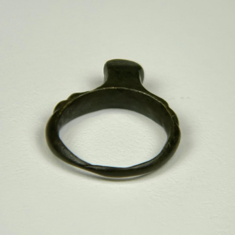Ancient Roman jewelry ring with flat bezel, subtle surface oxidation, and preserved cast construction