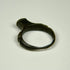 Roman bronze signet-style ring with intact rounded band and dark archaeological patination