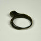 Roman bronze signet-style ring with intact rounded band and dark archaeological patination