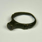 Ancient Roman finger ring with broad bezel, compact band, and preserved archaeological character