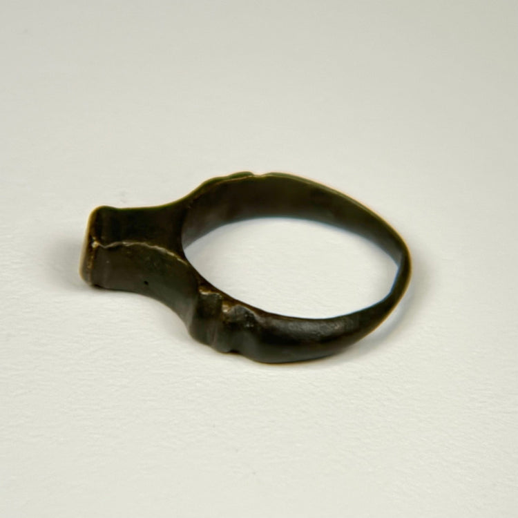 Ancient Imperial Roman finger ring displaying a broad bezel worn smooth through centuries of age